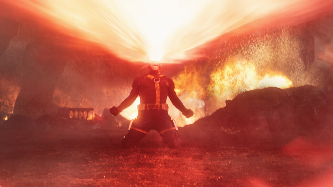A figure stands against a blazing cosmic horizon